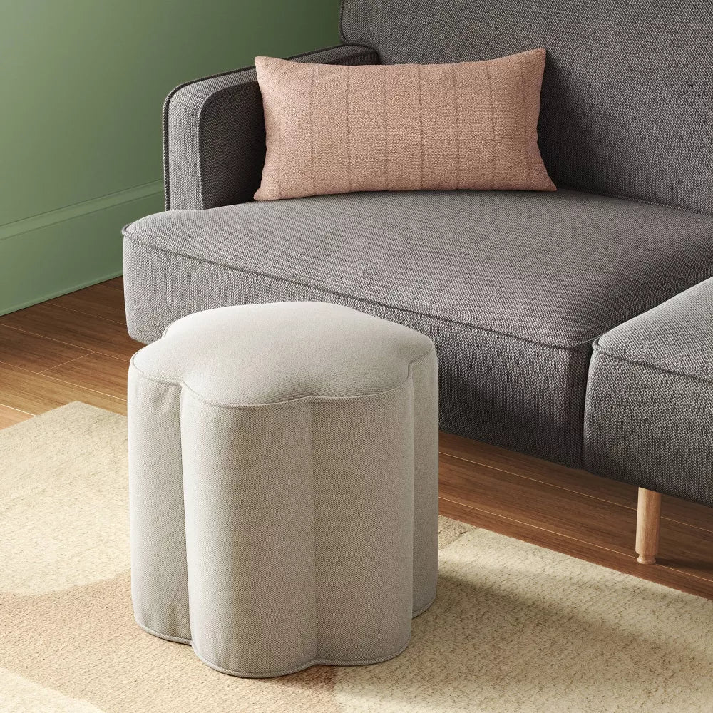 Gepolsterter Fußhocker mit welligem Blumenprofil und Holzrahmen